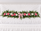 Pink and white carnation garland for inside the casket at a funeral